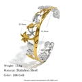 Detailed view of marine themed gold stainless steel cuff bracelet with starfish and seashell - Stainless Steel 18K Gold/Silver Two-tone / Ocean Element Bangle - Two-tone