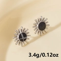 Detailed size view of silver sun flower earrings with black inlay, 1.6cm x 1.4cm size - Silver Black