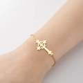 Elegant gold hollow flower cross charm bracelet with delicate chain on female wrist - 342-Hollow Flower Cross / Steel