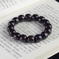 Polished ebony wood prayer beads bracelet on book background with natural grain - Ebony Classical Beads / 12mm*17 Beads / Black