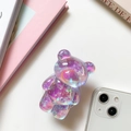 Macro shot of a 3D laser bear pop socket featuring aurora glitter for smartphones - Purple (Laser Glitter)
