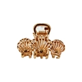 Detailed close-up of a golden metal claw clip featuring a unique three-shell design - Triple Shell Claw