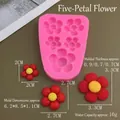 Macro detail of pink silicone mold with flower cavities and resin samples in three sizes - Five-Petal Flower