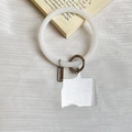 Universal white silicone phone wrist strap ring with gunmetal clasp and clear patch - Transparent White