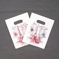 Detail of white plastic gift bag featuring French-style Paris themed art and die-cut handles - Paris Fashion Print Style (27) / 95 Pieces/Pack