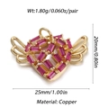 Macro detail of winged heart pendant featuring red stone and 18K gold-plated copper finish - Dbn147-09 / 18K Gold
