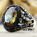 Macro detail of men's scorpion ring with amber stone and vintage silver engraving - Scorpion Relief Amber Stone(KJZ018XS)