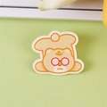 Cute cream yellow bear acrylic brooch pin with beret and glasses on green background - Dizzy Bear