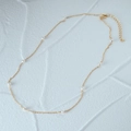 Close-up of elegant S925 silver pearl necklace with delicate gold chain and white pearls - Gold Thin Chain-Equidistant Pearl Accents