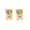 Close-up of 18K gold plated bear earrings with sparkling crystals and pink evil eye detail - Zirconia Bear Pink Evil Eye