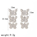 Boucles d'oreilles pendantes triple papillon en acier inoxydable avec détails texturés - Or 18 carats / Argent