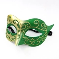 Close-up of a gold and green gradient masquerade mask with glitter floral patterns - Green