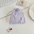 Detail of purple plaid drawstring pouch featuring pink bow patterns on a cotton fabric - Purple Gingham Bow