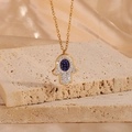 Gold Hamsa Hand necklace with blue evil eye pendant and sparkling zircon crystals - Gold Oval Style