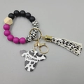 Silicone bead wristlet keychain with purple and black beads, cow print tassel and Mama cow tag - Violet