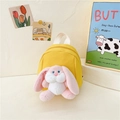 Yellow canvas kids backpack with a plush bunny charm and white top handle for toddlers - Yellow