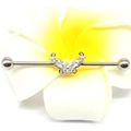 Macro shot of silver industrial barbell with butterfly zircon on plumeria flower - Silver Butterfly/White Zircon / Silver