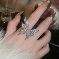 Macro shot of silver butterfly ring with pearls and zircons worn on a model's hand - 29# Silver Large Pearl Zirconia Butterfly Open Ring