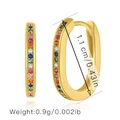 Detail view of gold hoop earrings with multi-colored zircons showing size and weight - Oval Rainbow Pave Huggie (KE0006)