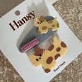 Detail of yellow puppy hair clips with Good Luck tag on a soft plush background - 2-Pack Cartoon - Cat