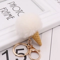Detailed close-up of a white faux fur pompom ice cream cone keychain with golden lobster clasp - Off-white