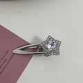 Detailed view of a silver star hair clip with pink rhinestones on a metal base - Silver/White Zirconia-Star Crystal