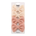 Detail of four-piece polyester bow hair clip set in cream and pink on display card - Beige/Pink