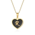 Detail of golden heart pendant featuring black enamel finish and the letter R on a thin chain - Letter R Style