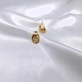 Elegant gold multi-layered hoop earrings displayed on white silk fabric background - Small Style (EH0142)
