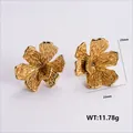 Golden flower earrings with hammered texture measuring 25mm height and 23mm width - Amleh035