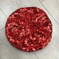 Detailed top-down view of shiny red sequins on a fashion beret hat for women - Red