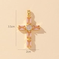 Detailed size view of gold cross pendant with pink gemstones measuring 3.5cm by 2cm - Style X-Pink & Clear Zirconia Cross