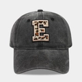Detail of washed black cotton baseball cap with leopard print embroidery letter E - Letter E