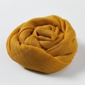 Artistic rolled yellow cotton linen scarf with soft pleated texture and vibrant color - Ginger Yellow