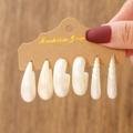 Detail view of vintage white earring set including teardrop and C-shape hoops on card - 3 Pairs White Texture Set (E0305-2)