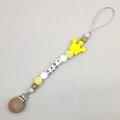 Detail of wooden pacifier clip with silicone crown bead and BABY letter beads - Yellow