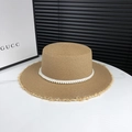 Light brown straw sun hat with elegant pearl band and frayed edges for beach vacations - Adjustable / Khaki