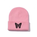 Close-up of pink ribbed knit beanie featuring detailed black butterfly embroidery - One Size / Dusty Pink