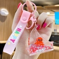 Pink liquid glitter keychain with cartoon octopus in ship pendant and happy wristlet - Ocean Creature - Octopus