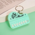 Miniature mint green piano keychain toy with 7-key musical function and metal ring - Bag Packaging / Macaron Cyan