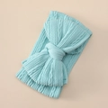 Detailed texture of light blue knitted baby headband with a large double layer bow - Sky Blue