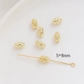 Gros plan de perles ovales creuses dorées 5x8mm pour la création de bijoux DIY à la main - 5*8mm / Or 14K