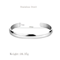 Minimalist silver stainless steel C-shaped cuff bracelet with a polished smooth finish - Female Style / Silver