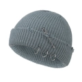 Close-up of greyish blue knitted beanie featuring three metal rings and a large safety pin - 55-58cm / Grey Green