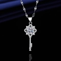 Elegant silver key necklace with sparkling round main stone and snowflake pattern detail - Xl-154 [with Four-leaf Clover Chain]