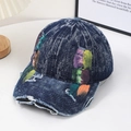 Distressed denim baseball cap with street style graffiti patches and frayed edges - Dark Blue