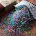 Colorful macaron kids hair ties pouring from a whale patterned frosted zipper bag - Approx. 1000Pcs/Bag / Spring Colors