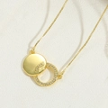 Elegant gold choker necklace featuring a double circle pendant with sparkling crystals - Zirconia Double Ring