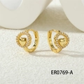 Close-up of golden heart hoop earrings with sparkling micro-set white zircon stones - Hollow Heart Design (ER0769-A)
