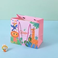 Pink cartoon animal gift bag with woven handles featuring Happy Times giraffe design - Pink Animals Style